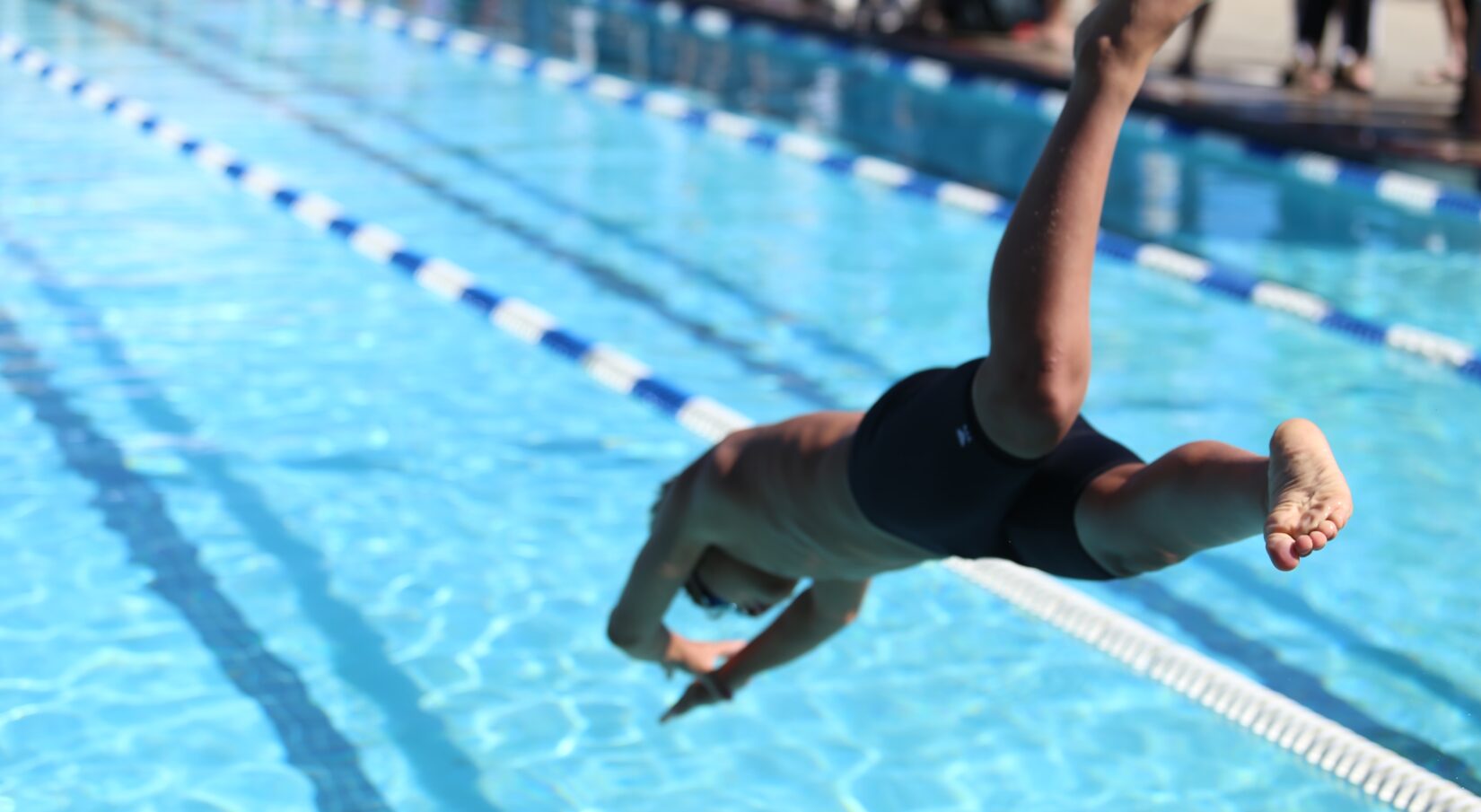 boy driving into pool