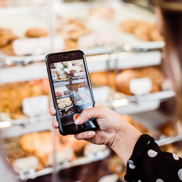 lady taking photo of croissants in Bowral