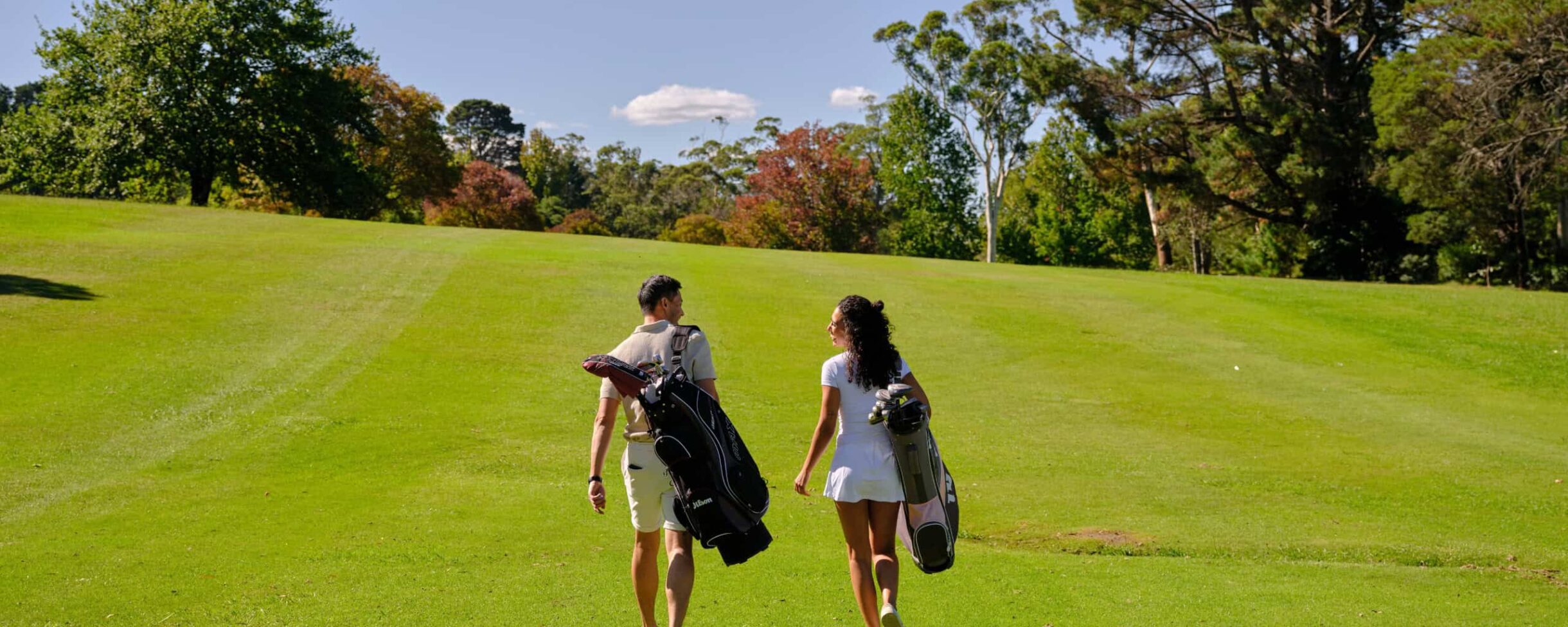 Man and Women walking the Gibraltar Bowral Golf Course