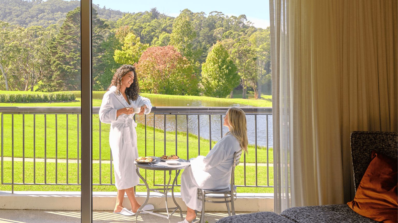 Two ladies on the balcony overlooking the Gibraltar Golf Course